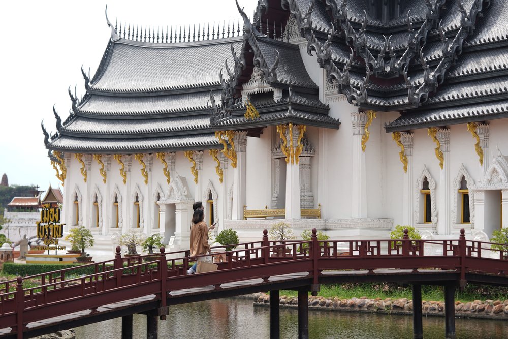 Man and woman walking on a bridge