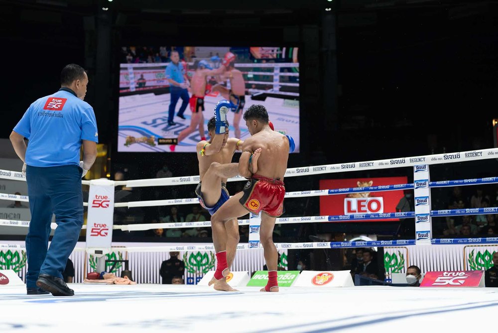 Two men fighting inside the ring