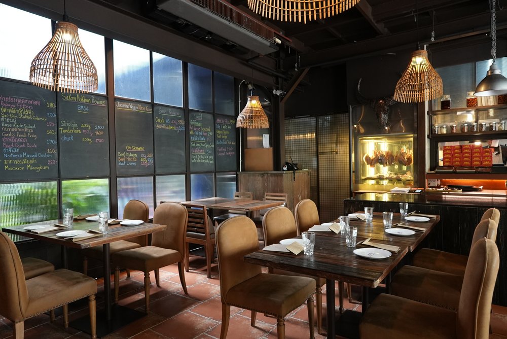 Tables and chairs set up in a restaurant