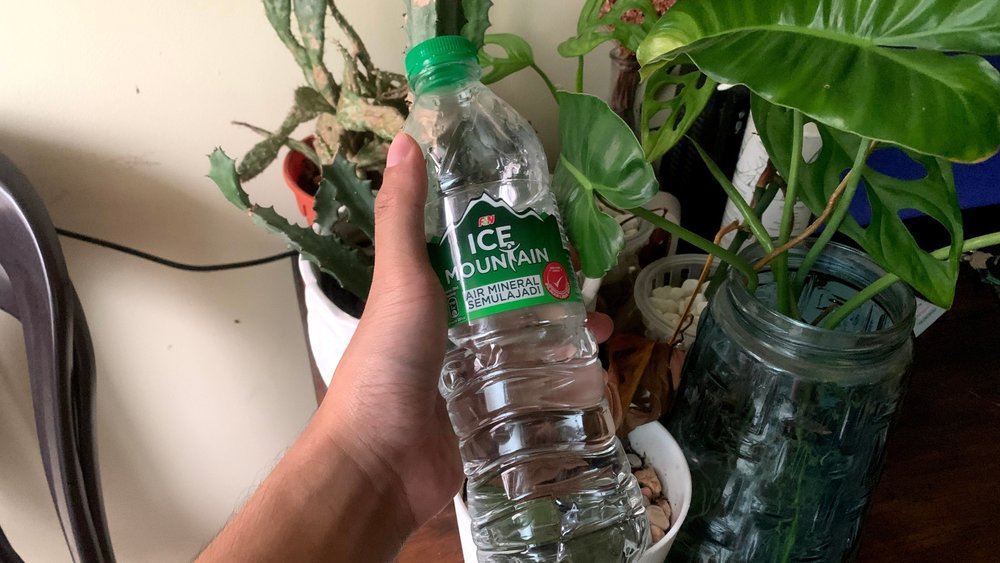 Bottled water can help you cool down during a hot day in Bali