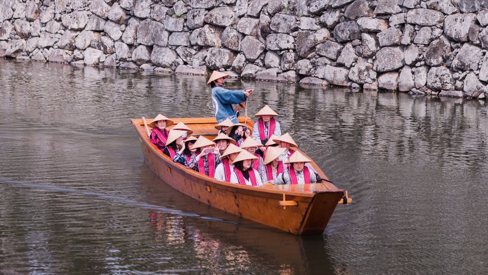 See the sights as you take a boat tour. Credits to Kit Ko on Unsplash