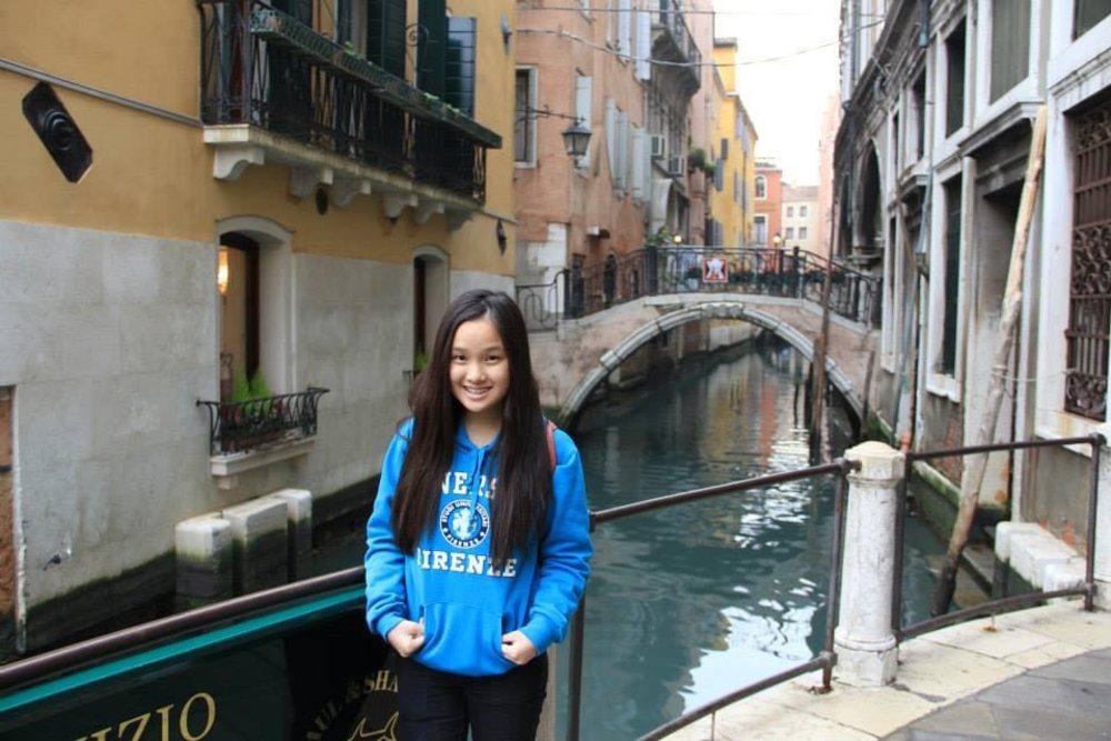 girl posing with canals in venice