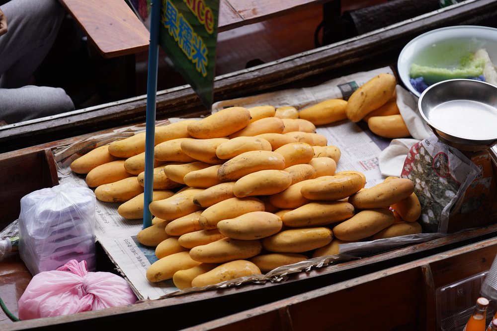Many mangoes on a boat