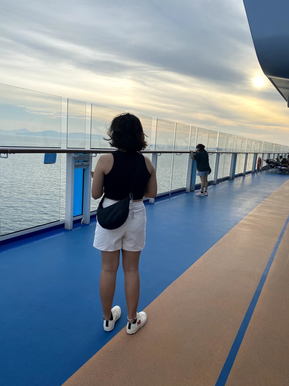 girl posing on the deck of a cruise ship