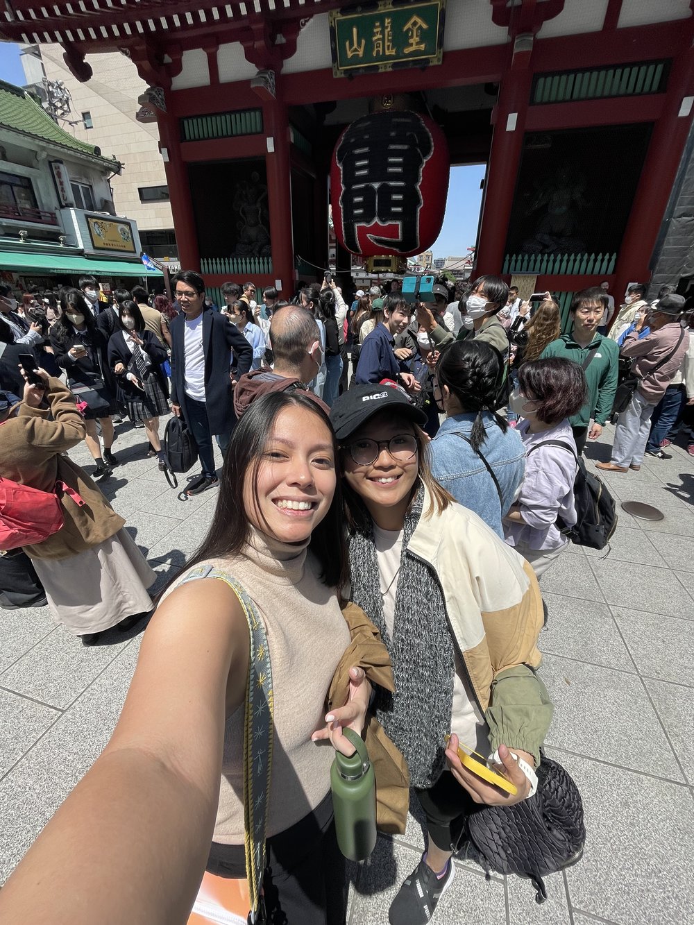 two women posing in a famous landmark in japan