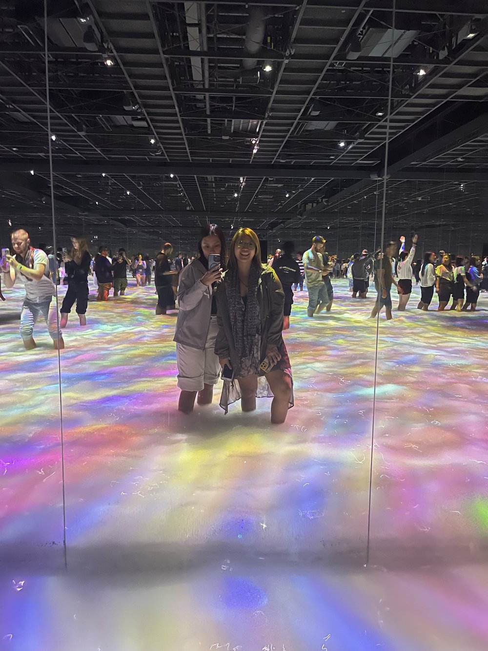 two women pose in an art installation in japan