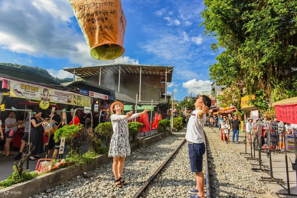 Couple flying a sky lantern