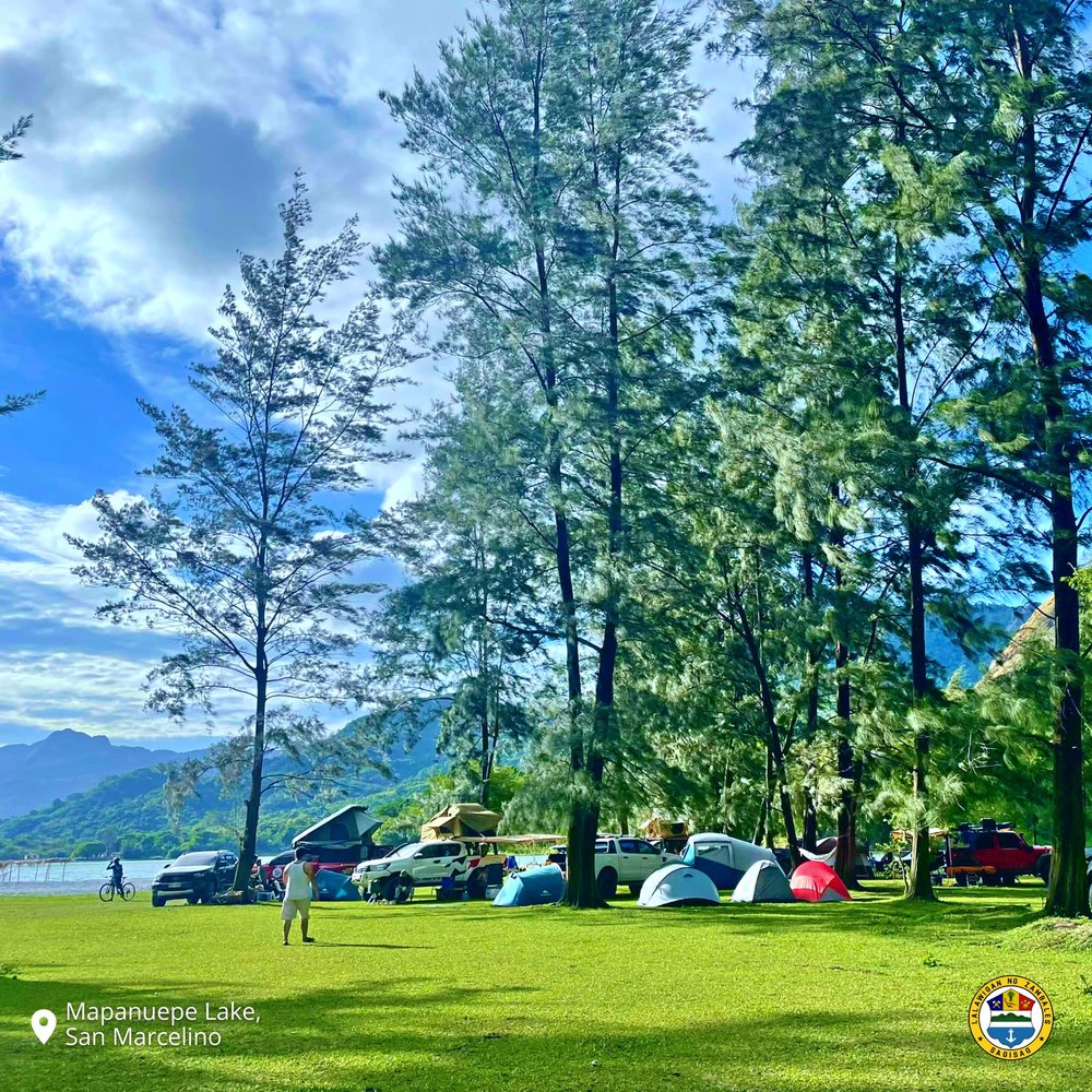 People camping in Lake Mapanuepe