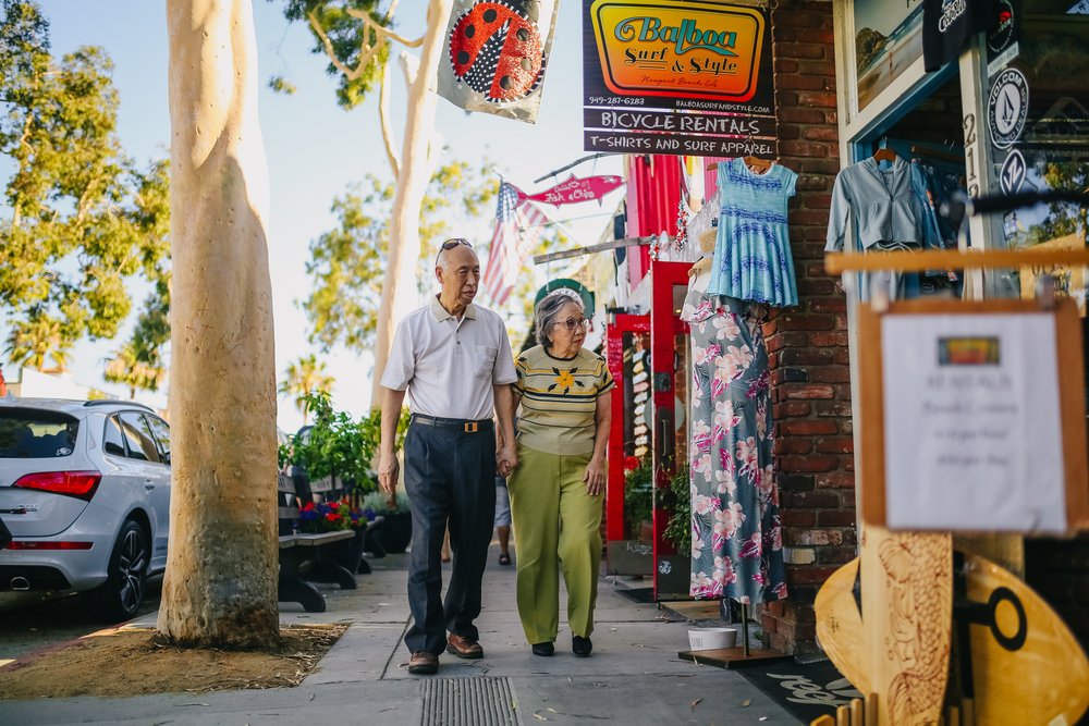 Two seniors walking down the street