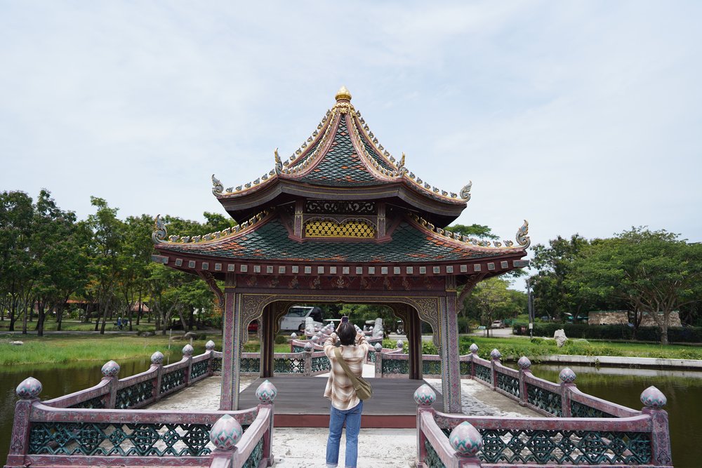 Man taking a photo of a temple