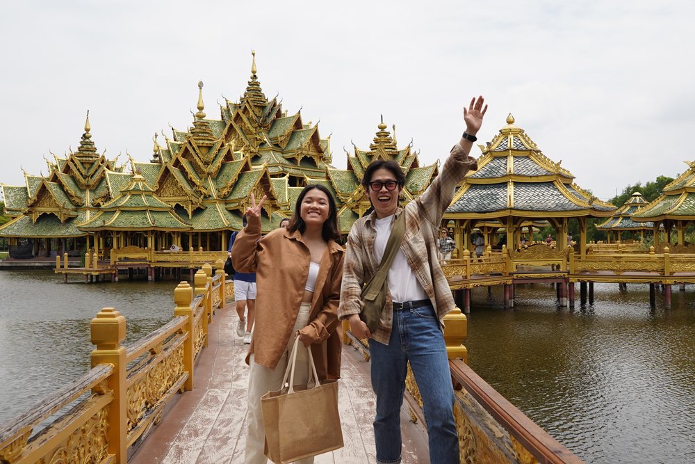 Man and woman standing in front of a temple