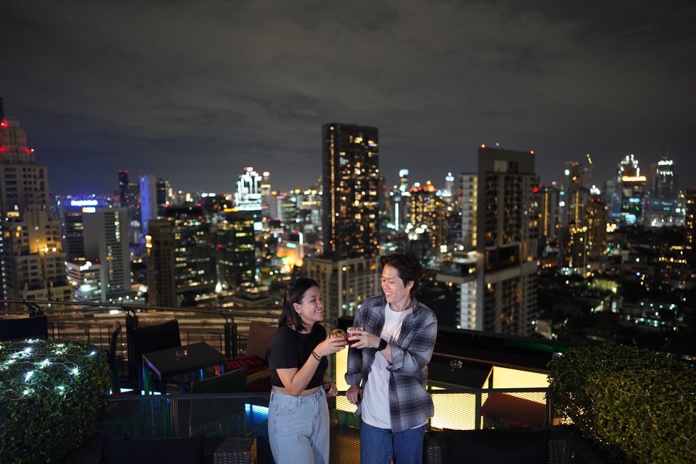 Man and woman happily clinking glass