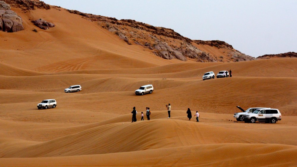 Red Dunes by Quad Bike, Camel Ride, and Sandboarding with BBQ Dinner