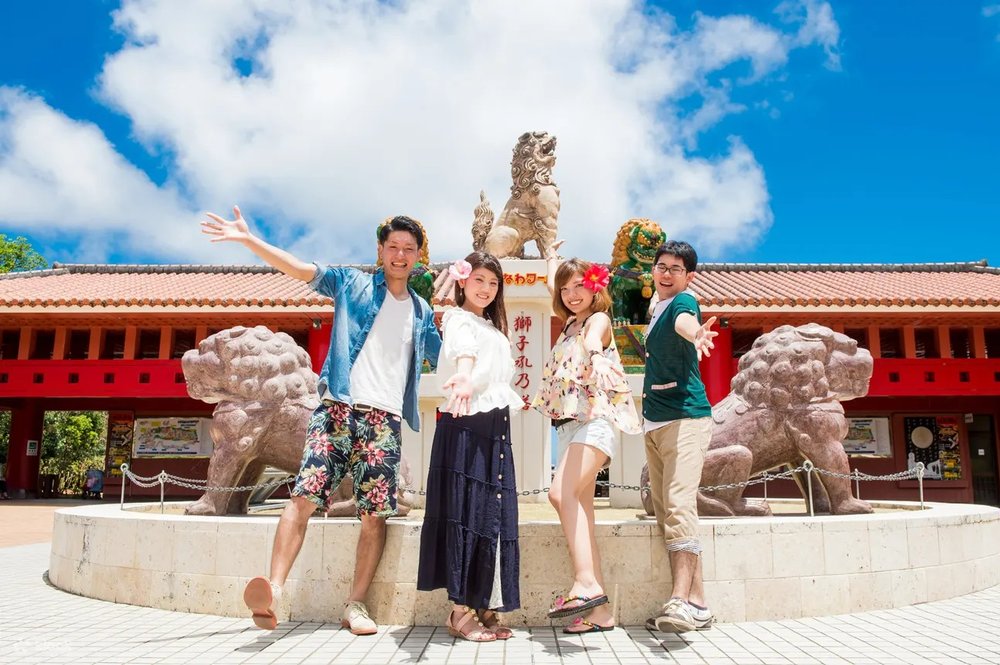 Tourists posing in front of a landmark