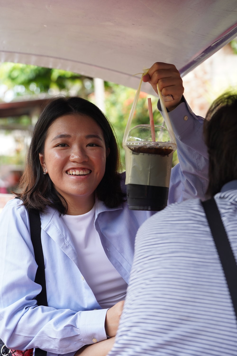 Girl holding a cup of iced coffee