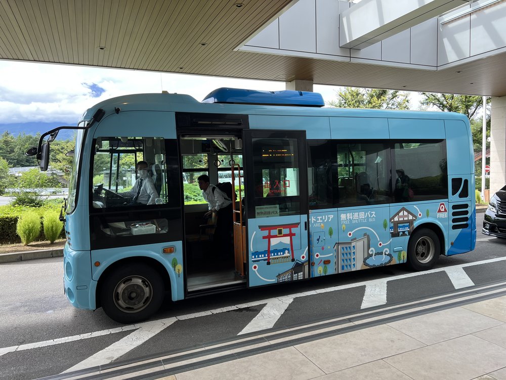 blue-colored shuttle bus