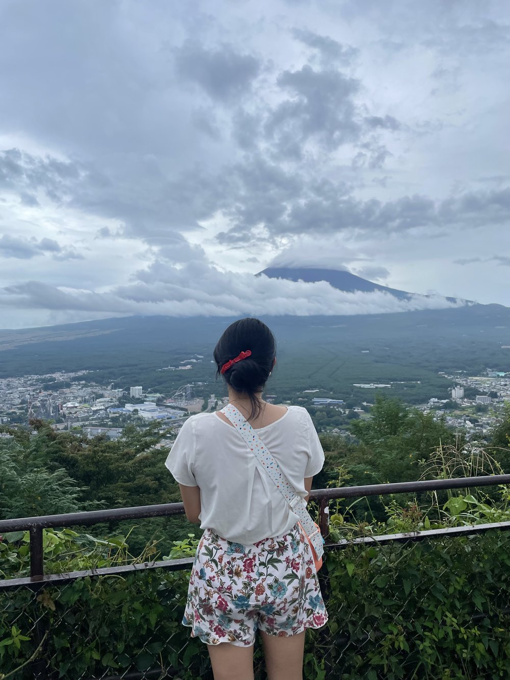 girl looking at mt fuji during the summer