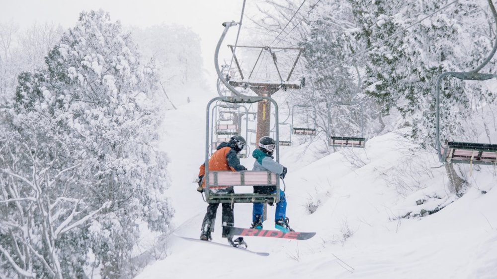 Up, up, and away! The chairlift in Hakuba is your gateway to snowy fun and excitement. Credits: Delphine Ducaruge on Unsplash