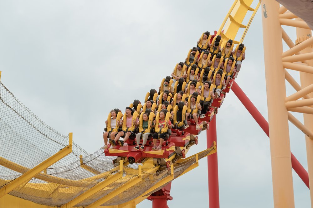People riding the roler coaster