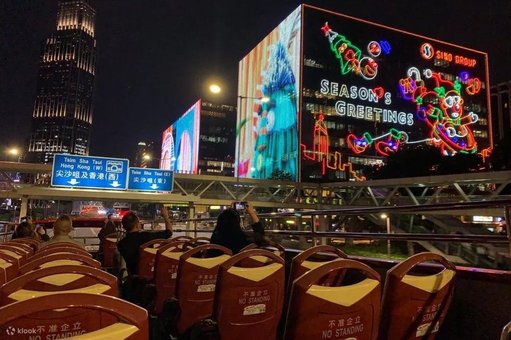 Tourist riding the hop on hop off bus tour