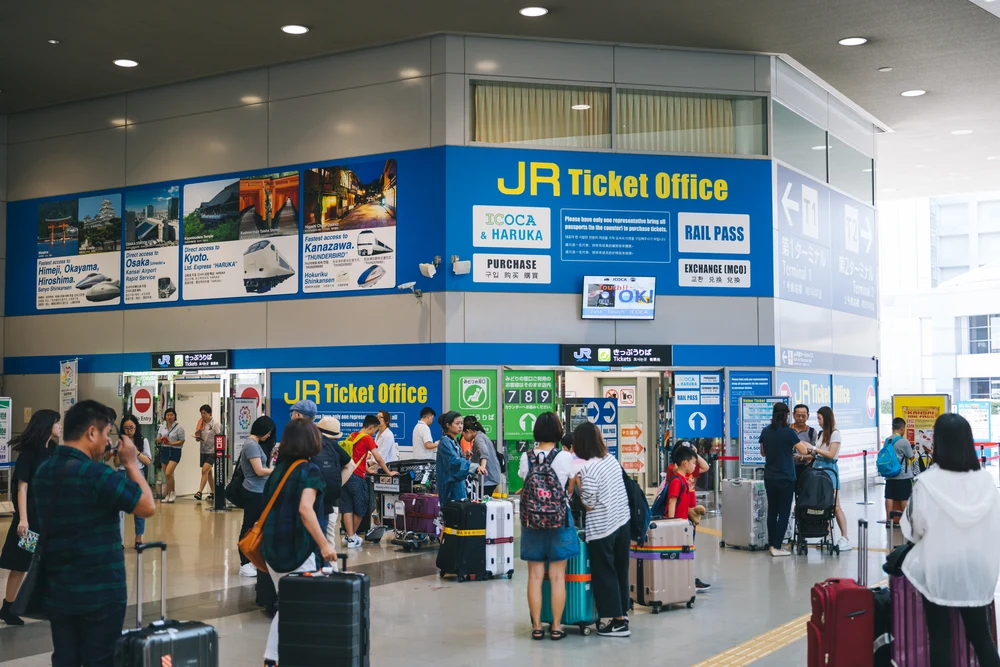 People standing outside a JR ticket office