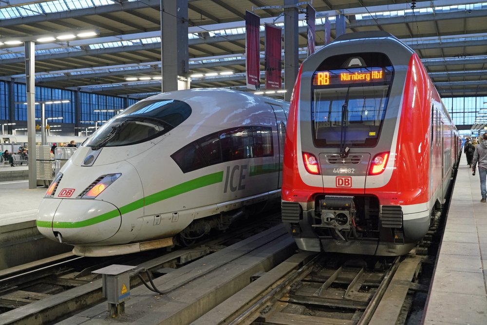 A white train and a red train