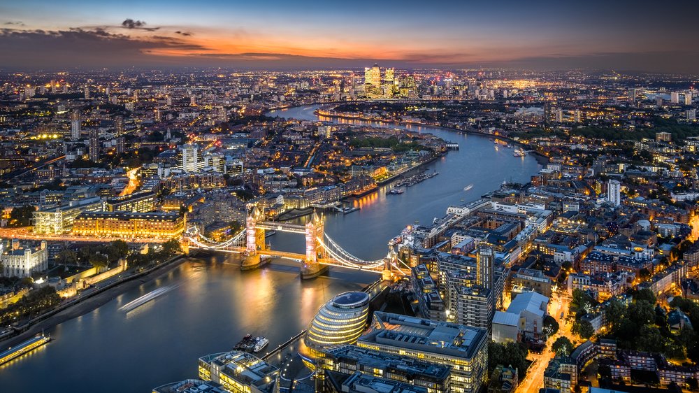 london tower bridge and thames river at night