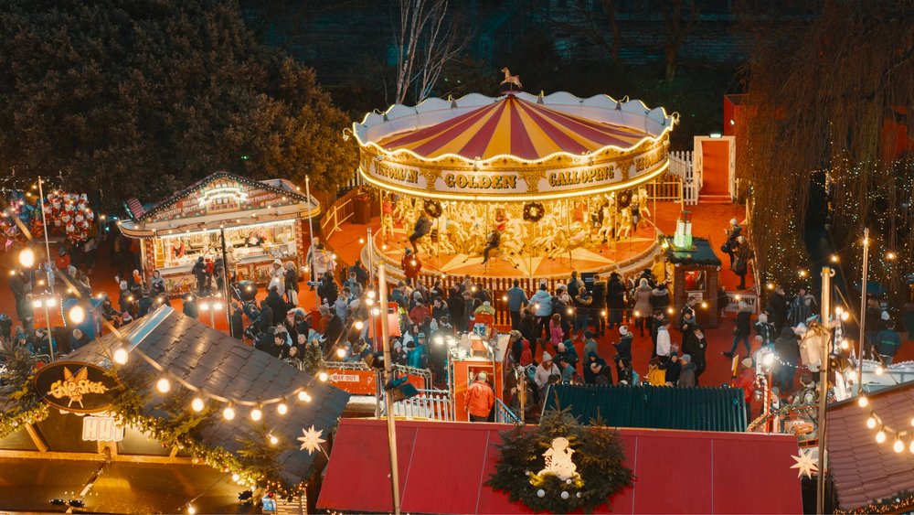 United Kingdom  Edinburgh Christmas Markets  [Add image and caption - A Christmas market with rides? Count us in! Credits to @rosssneddon on Unsplash