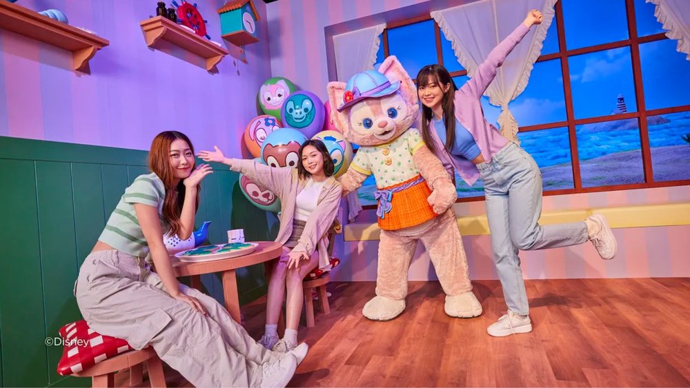 People smiling for a photo with mascots