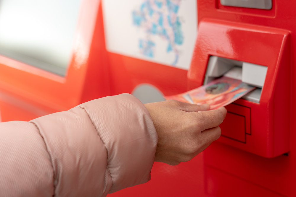 woman buying an sbb train ticket in switzerland