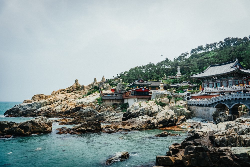 rocky seaside island and a traditional Korean structure