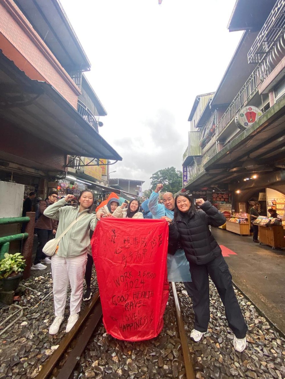 A family holding a red sky lantern