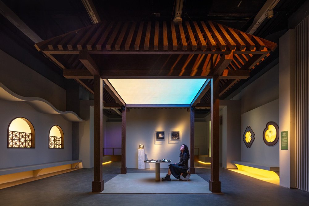 Lady sitting inside an art piece