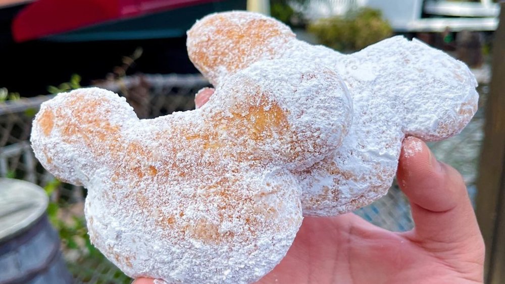 Indulge in the whimsical delight of Mickey-shaped Beignets, where every bite is a sprinkle of magic! Image credits to @code_word_disney on Instagram.