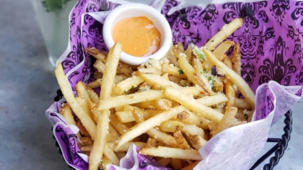 Experience the enchanting flavors of Pommes Frites! Image credits to @foodatdisneyland on Instagram.