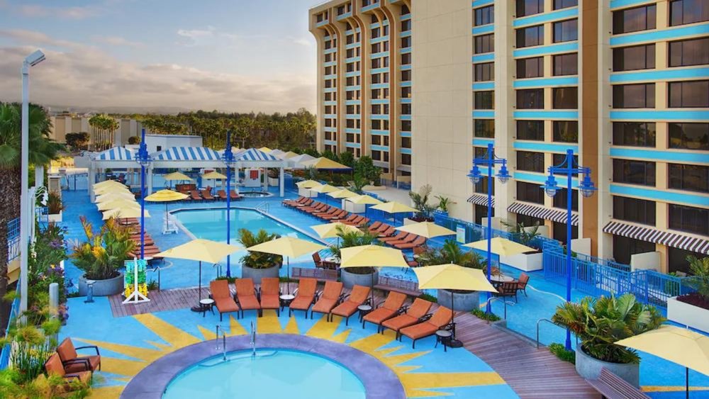 Take a dip on one of Paradise Pier Hotel's giant pools and splash pad! Credits to Klook