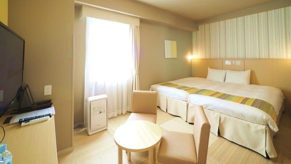 Check in to a comfy hotel room after a long day at the park. Credits to Klook