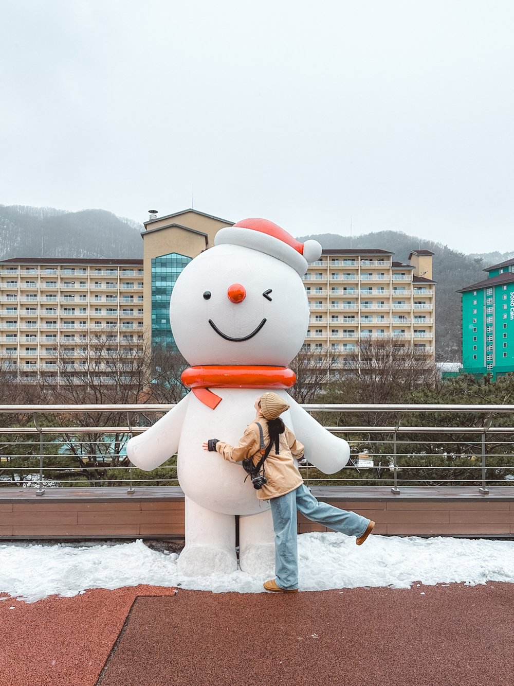Woman with a giant snowman