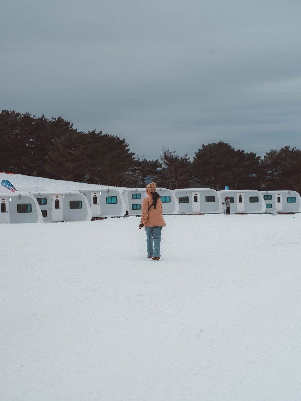 Woman standing in snow