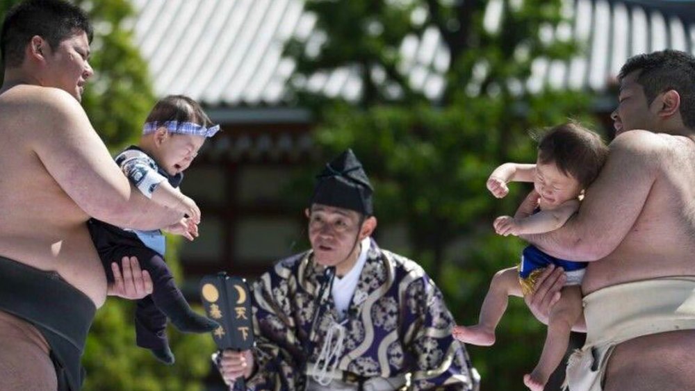 Have a good laugh watching sumo wrestlers competing to make babies cry the fastest! Credits to @viapublicacol on Instagram