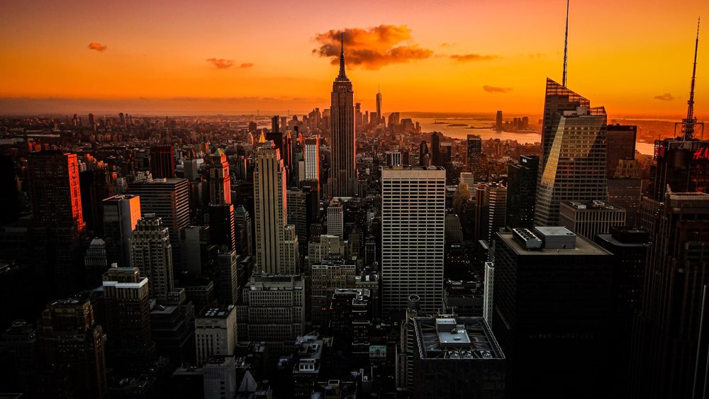 Watch the sun set over the city with your partner.  Credits: Florian Wehde on Unsplash