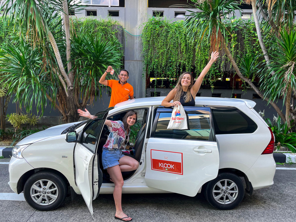 posing with their bali mode of transportation