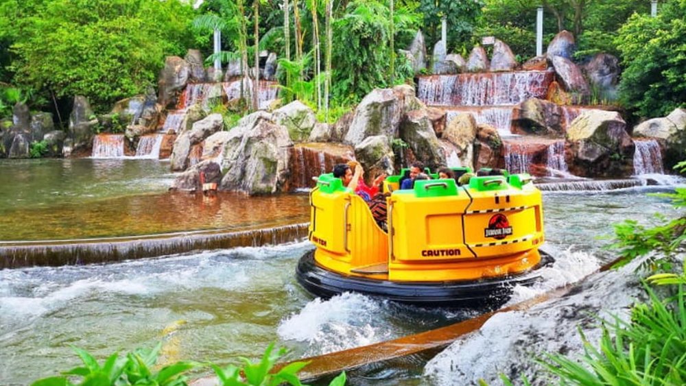 Cruise the whitewater rapids with your friends at Jurassic Park Rapids Adventure! Credits: Klook