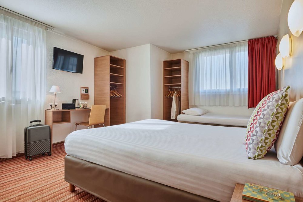 a room inside the campanile hotel paris