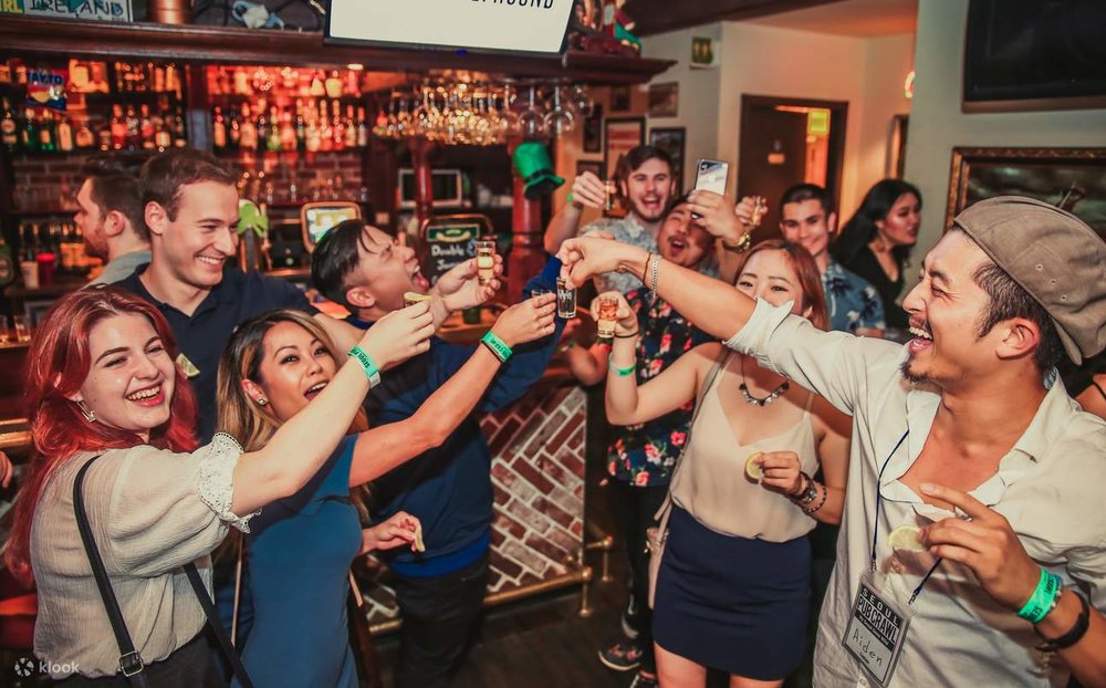 people cheers in a bar