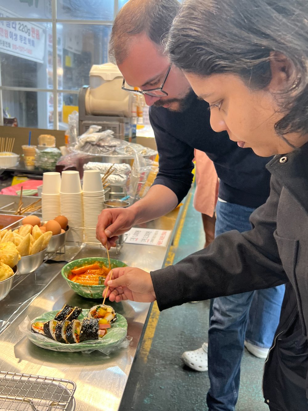 people trying out korean food