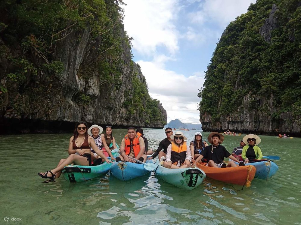 family kayaking in big lagoon