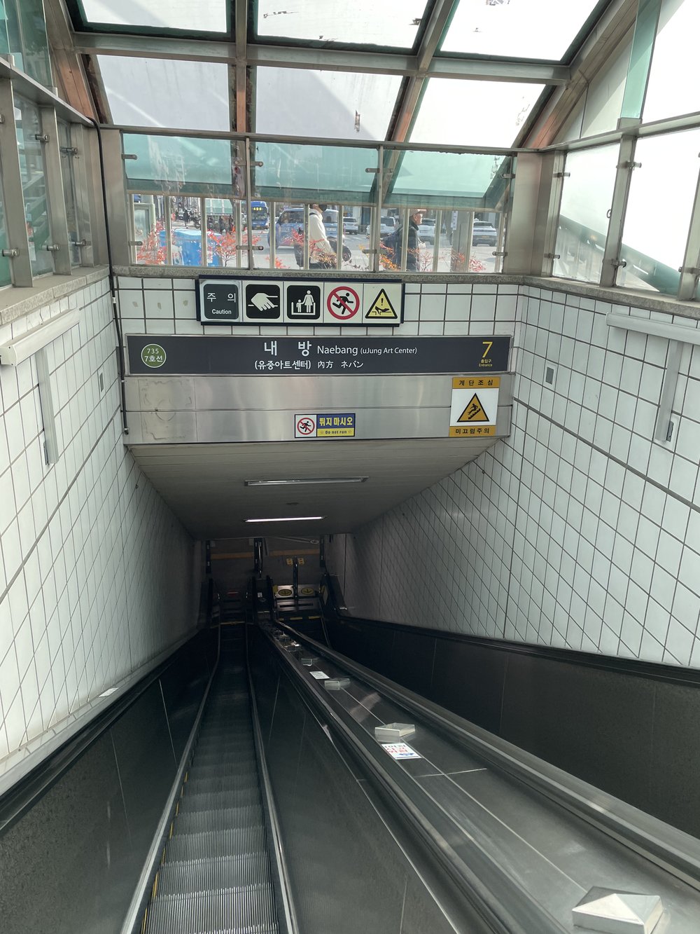 escalator heading to a subway station