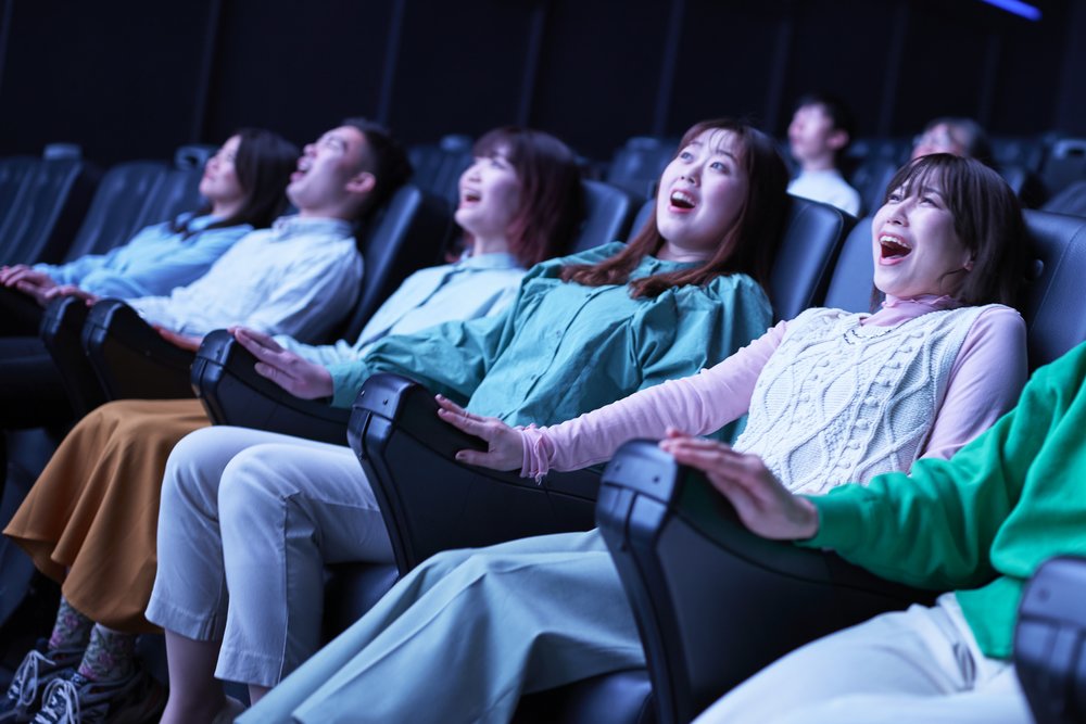 people getting surprised in an amusement park ride