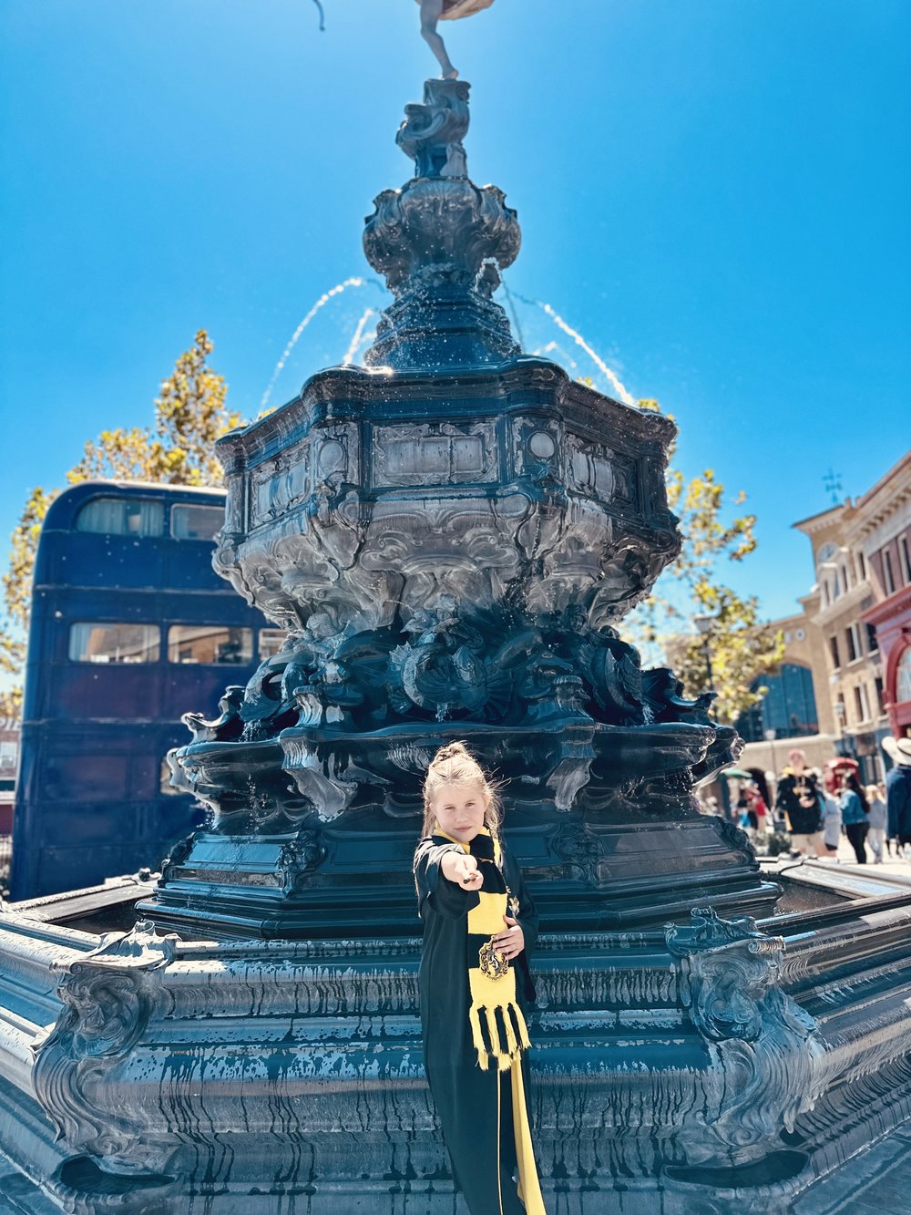 little girl posing with a wand